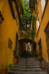 Fototapeta na wymiar Bellagio, Como lake, Lombardy, Italy. Editorial picture of small narrow alleys and stairs in the city of BellagioBellagio Como lake
