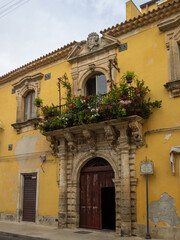 Fototapeta na wymiar Palazzo Pizzo yellow facade, Palazzolo Acreide