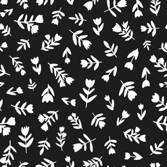 White silhouette flowers and leaves seamless repeat pattern. Random placed, vector botanical all over print on black background. Perfect as background, wallpaper, textile, fashion print and more.