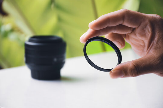 UV filter of camera lens in the hand