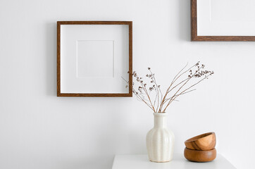 Square wooden frame mockup for artwork, photo, print and painting presentation. White walll with...