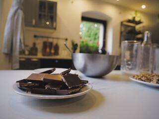 Chocolate and other ingredients for a cake on a table