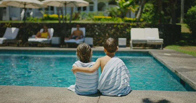 Family lifestyle at the pool, relaxing and enjoying summer vacation