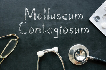 Molluscum contagiosum is shown on the medical photo using the text