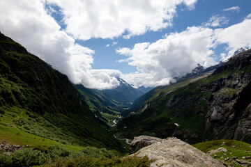Fototapeta premium valley madraner uri switzerland clouds mountains hiking day