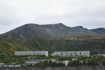 Fototapeta na wymiar view of Soviet houses in the mountains in autumn