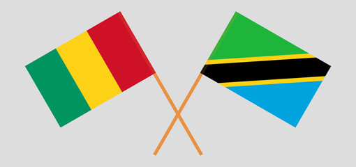 Crossed flags of Guinea and Tanzania. Official colors. Correct proportion