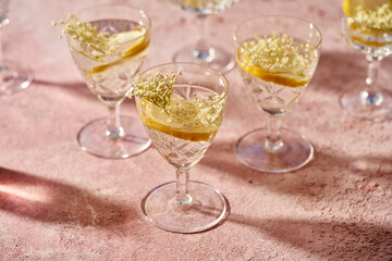 Elder flowers in a glass of lemonade. Herbal or alternative medicine.