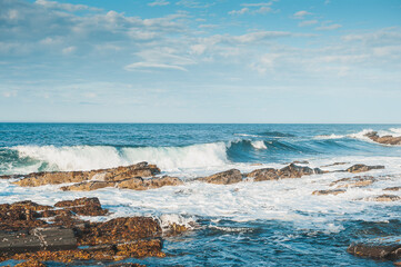 Sea waves crashing on rocks