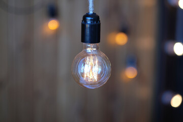 Close up of luxury round light bulbs in a vintage living room. Vintage lightbulb on dark background.