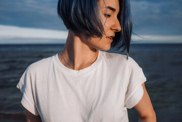 Active healthy young woman enjoying a sandy baltic beach.