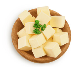 butter cubes in wooden bowl isolated on white background with clipping path and full depth of field. Top view. Flat lay