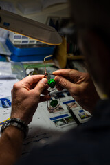 Making glasses for optics, inserting lenses. Handmade by a master.