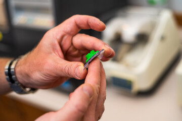 Making glasses for optics, inserting lenses. Handmade by a master.