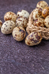Obraz premium Quail eggs on the wooden plate. Quail eggs can be consumed by frying or boiling. In Indonesia quail eggs called telur puyuh.