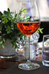 A set table with one glass of wine, alcoholic drink