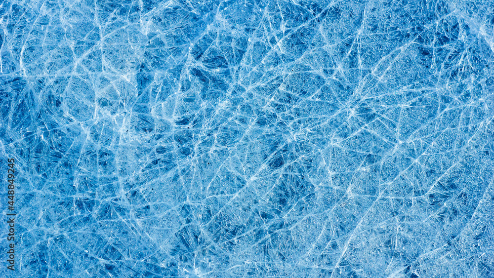 Aufkleber beautiful ice texture with cracks of a frozen puddle on the asphalt for 3d texturing or design.