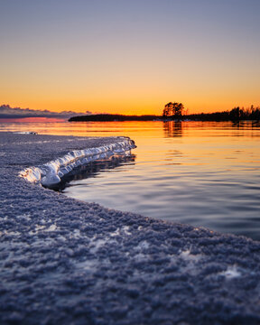 sunrise over the sea with ice on the foreground