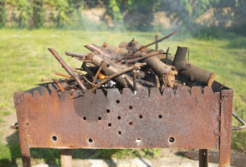 Cut branches in a chargrill outdoors