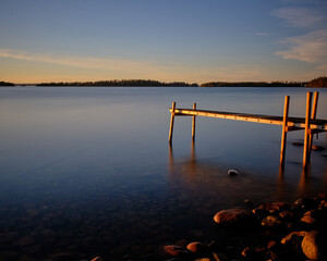 sunset on the lake with a jetty