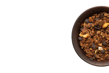 Chocolate granola cereal with nuts in a bowl background.