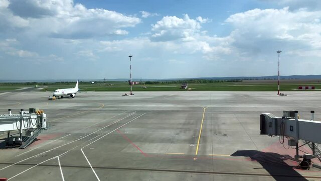 Towing the aircraft to the runway. Airport at the sunny day