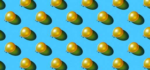 Pattern of golden balloons on blue pastel background