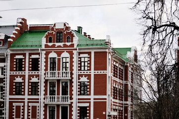 A building of red and white brick with large windows. Russia Yoshkar Ola 01.05.2021. High quality photo