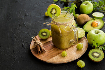 Healthy smoothie of fresh green fruits. Creative atmospheric decoration