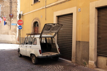 Fototapeta na wymiar Antrodoco Street View with White Vintage Car, Central Italy
