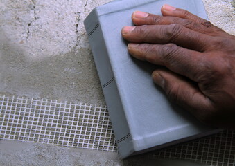 black man praying with hand on the bible stock photo
