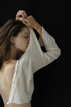 sensual portrait of young woman on black background