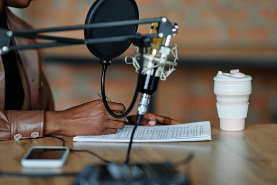 Person writing new ideas for podcast 