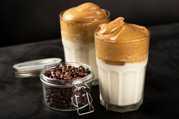 Iced Dalgona Coffee, glass with milk and coffee cream.