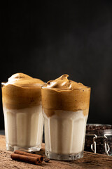 Iced Dalgona Coffee, glass with milk and coffee cream.