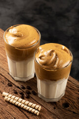 Iced Dalgona Coffee, glass with milk and coffee cream.