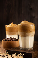 Iced Dalgona Coffee, glass with milk and coffee cream.