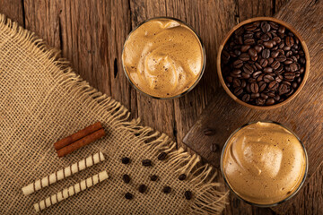 Iced Dalgona Coffee, glass with milk and coffee cream.