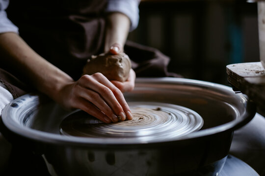 Sculptor doing pottery in art space 