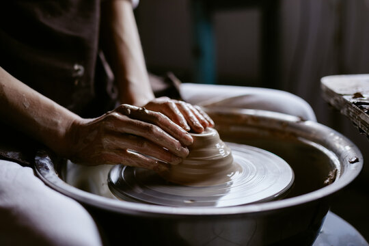 Crafter creating ceramic bowl 