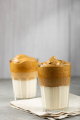 Iced Dalgona Coffee, glass with milk and coffee cream.