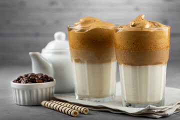 Iced Dalgona Coffee, glass with milk and coffee cream.