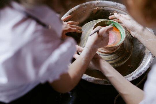Artist scratching clay for decorative purpose 