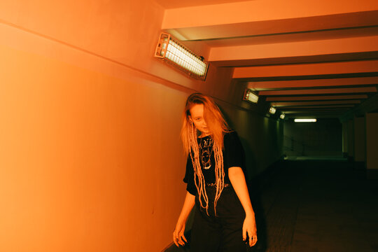 Young  woman flashed with red light