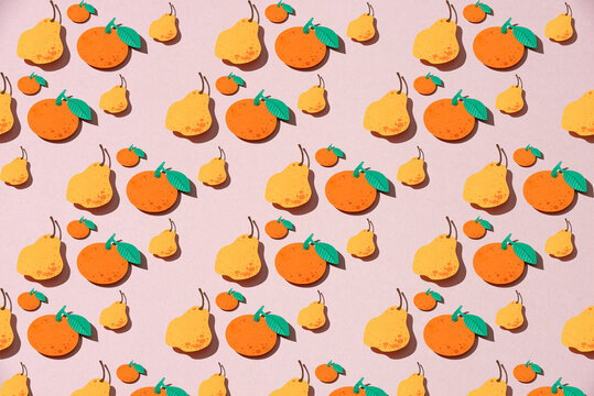 Falling citrus fruits and pears isolated on pink. Seamless pattern background