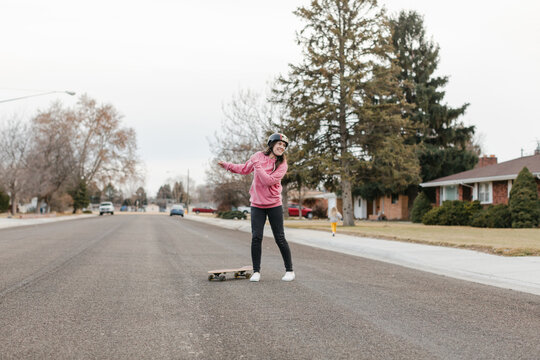 Smiling Woman Fell Off Skateboard