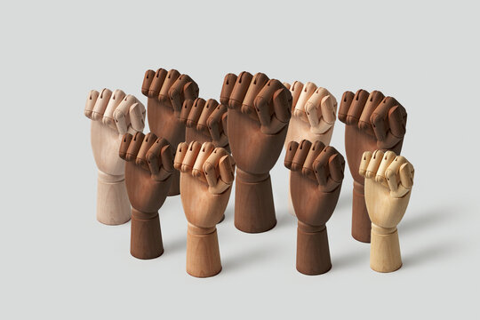 Different wooden hands with fists up