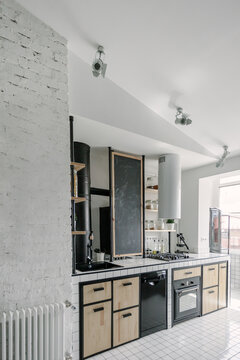 Wood and tiles kitchen countertop with a blackboard