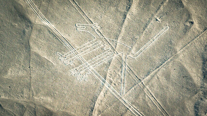 The Dog Nazca ancient mysterious geoglyph. Nazca lines as seen from the aircraft. Nazca lines are landmarks of Peru