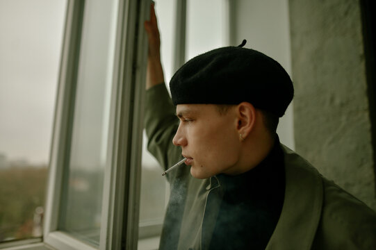 portrait of a young guy in a black beret